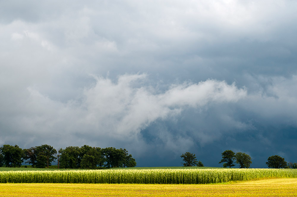 Storm clouds over a rural landscape.