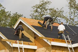 Roofers on a roof